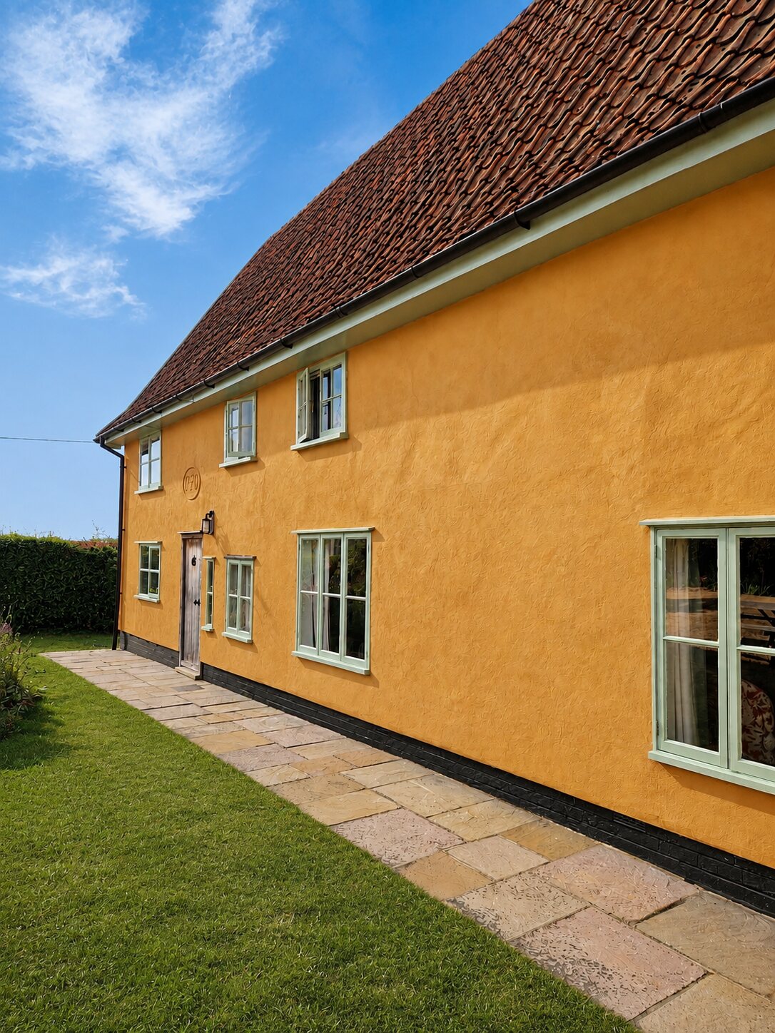 Traditional period interior with exposed timber beams and lime plaster walls