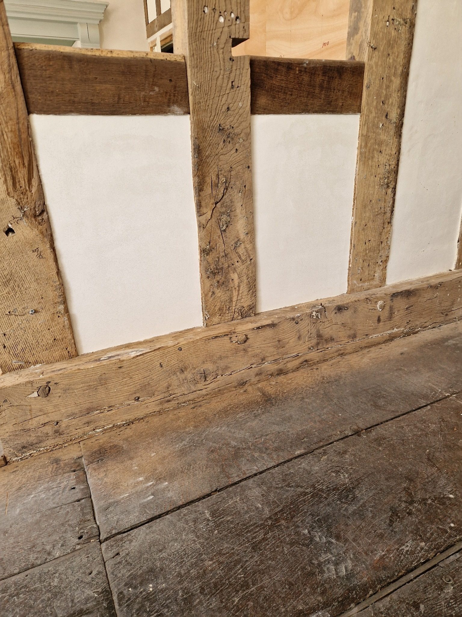 Finished lime plaster surrounding a window in a period property
