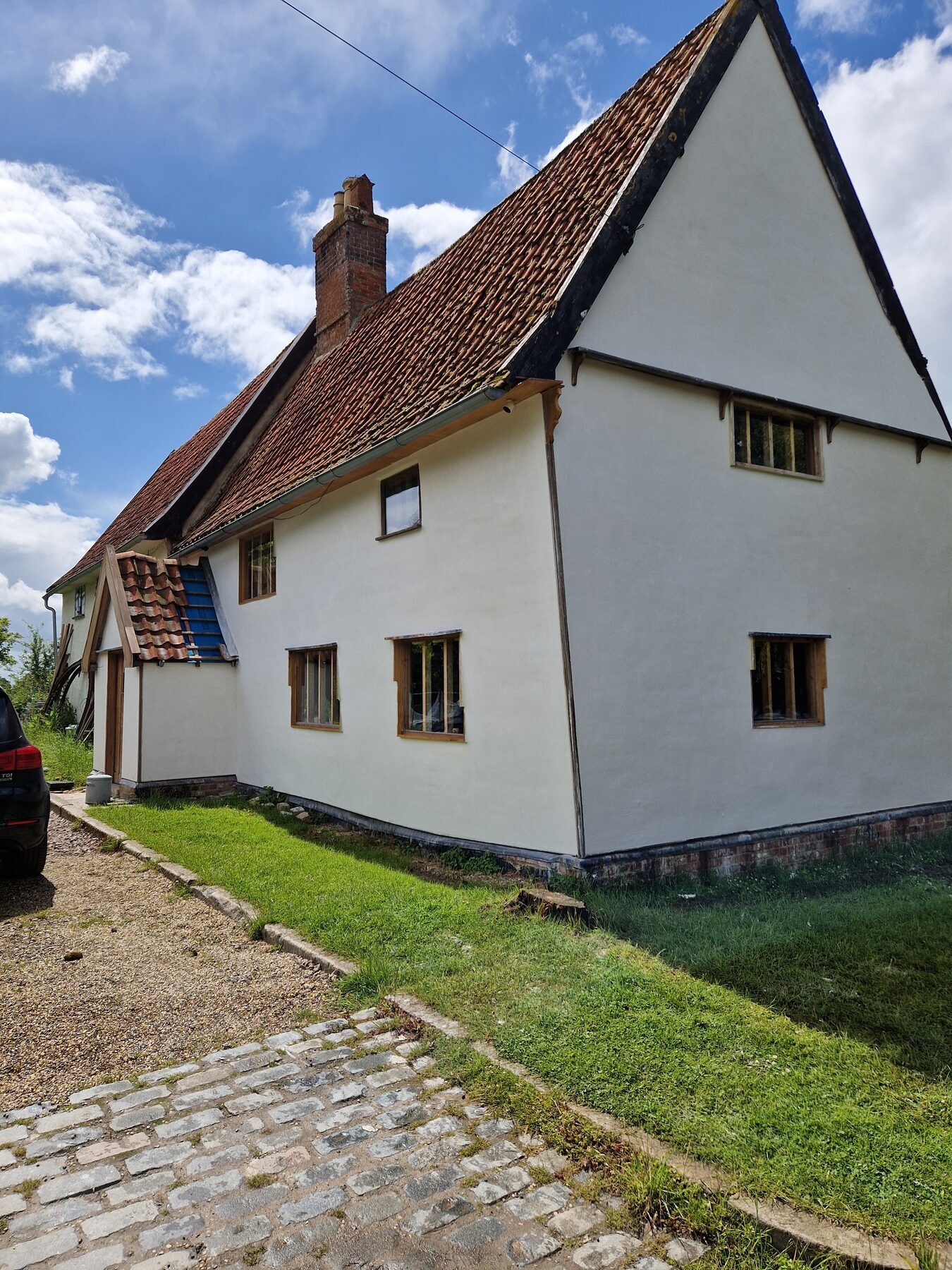 Completed lime rendering on a 15th century Grade II listed home in Norfolk